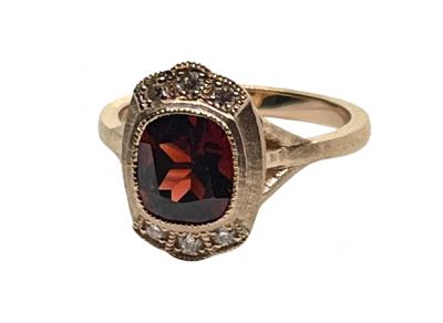 Modern Garnet And Diamond Ring