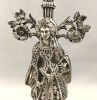 Figural Silvered Metal Garniture Candlesticks