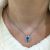 Modern Blue Topaz and Diamond Pendant