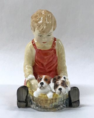 Paragon Figurine Pals,  a Young Boy and a Basketful of Puppies