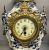 Three Piece Garniture of a Mantle Clock & Candelabra