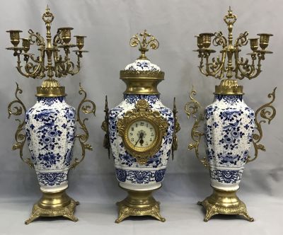 Three Piece Garniture of a Mantle Clock & Candelabra