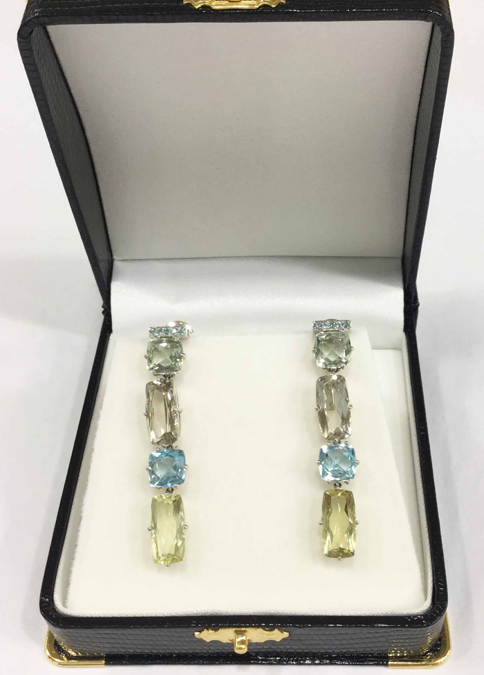The contemporary earrings in a box