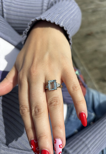 A close up picture of Auytmn's vintage aquamarine and diamond engagement ring, congratulations!