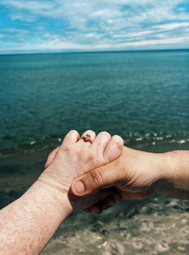 Victoria and Clive's engagement picture of the ring holding hands, congratulation!