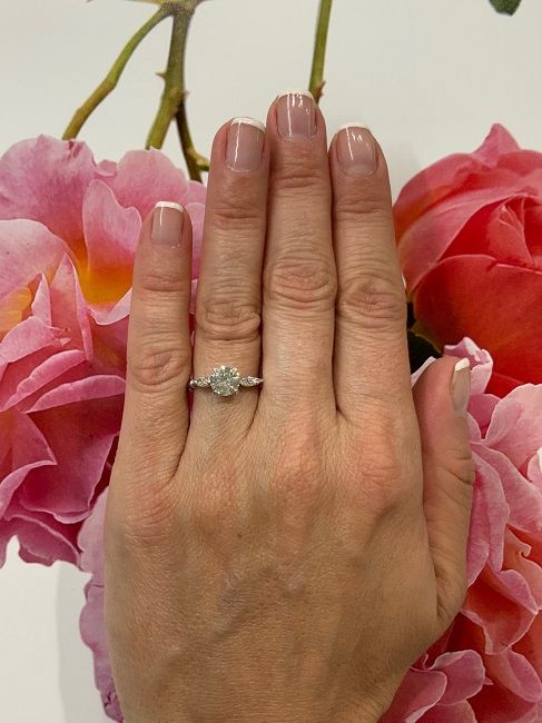 1.22ct Round Brilliant Cut vintage diamond engagement ring set in platinum, shown on a model's hand.